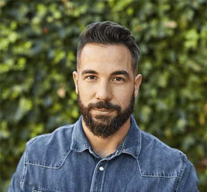 Man with great eyebrows smiling